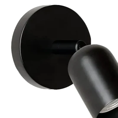 Närbild av den runda svarta HL293 väggplattan och den korta metallarmen