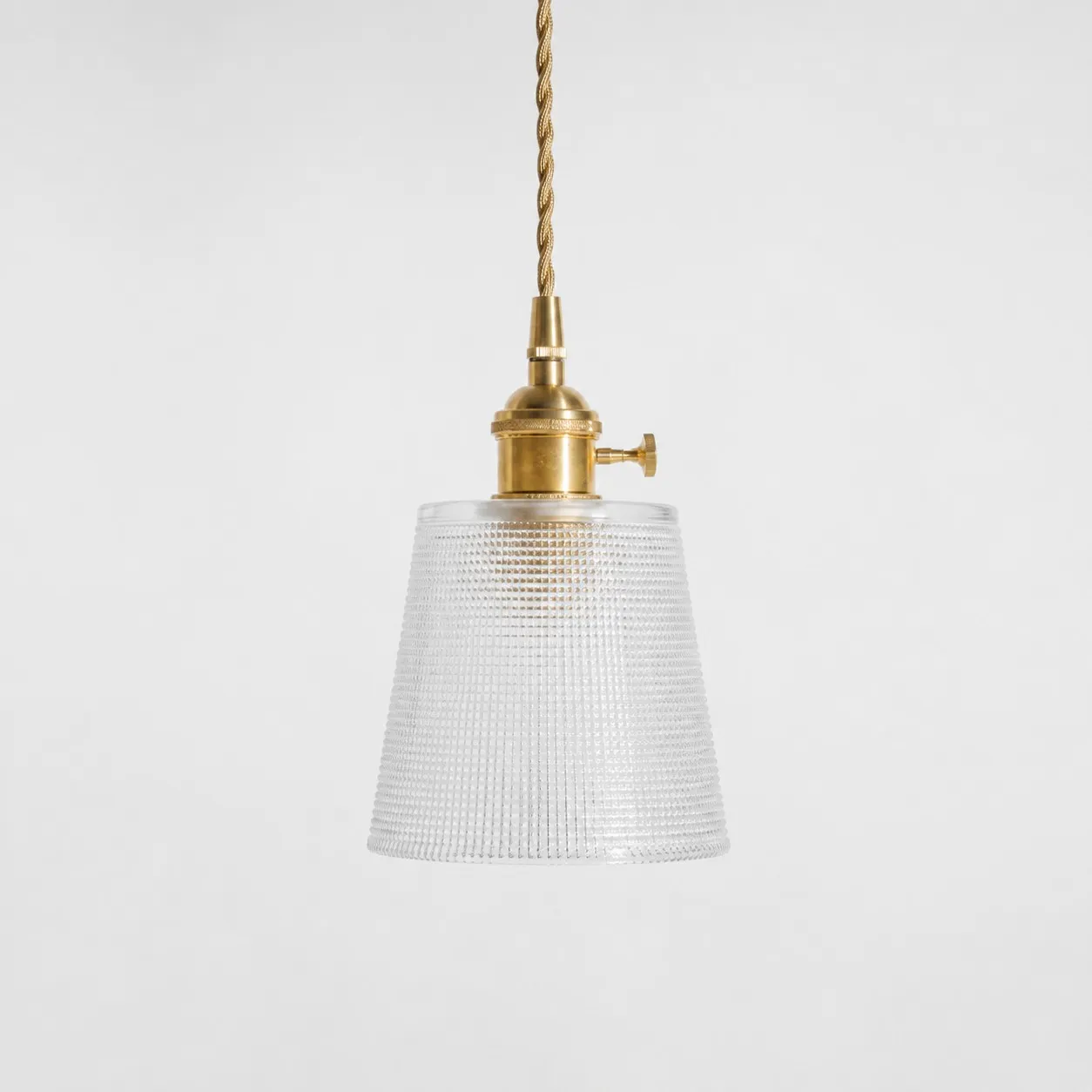 Style B textured glass shade with antique brass E27 socket, front view