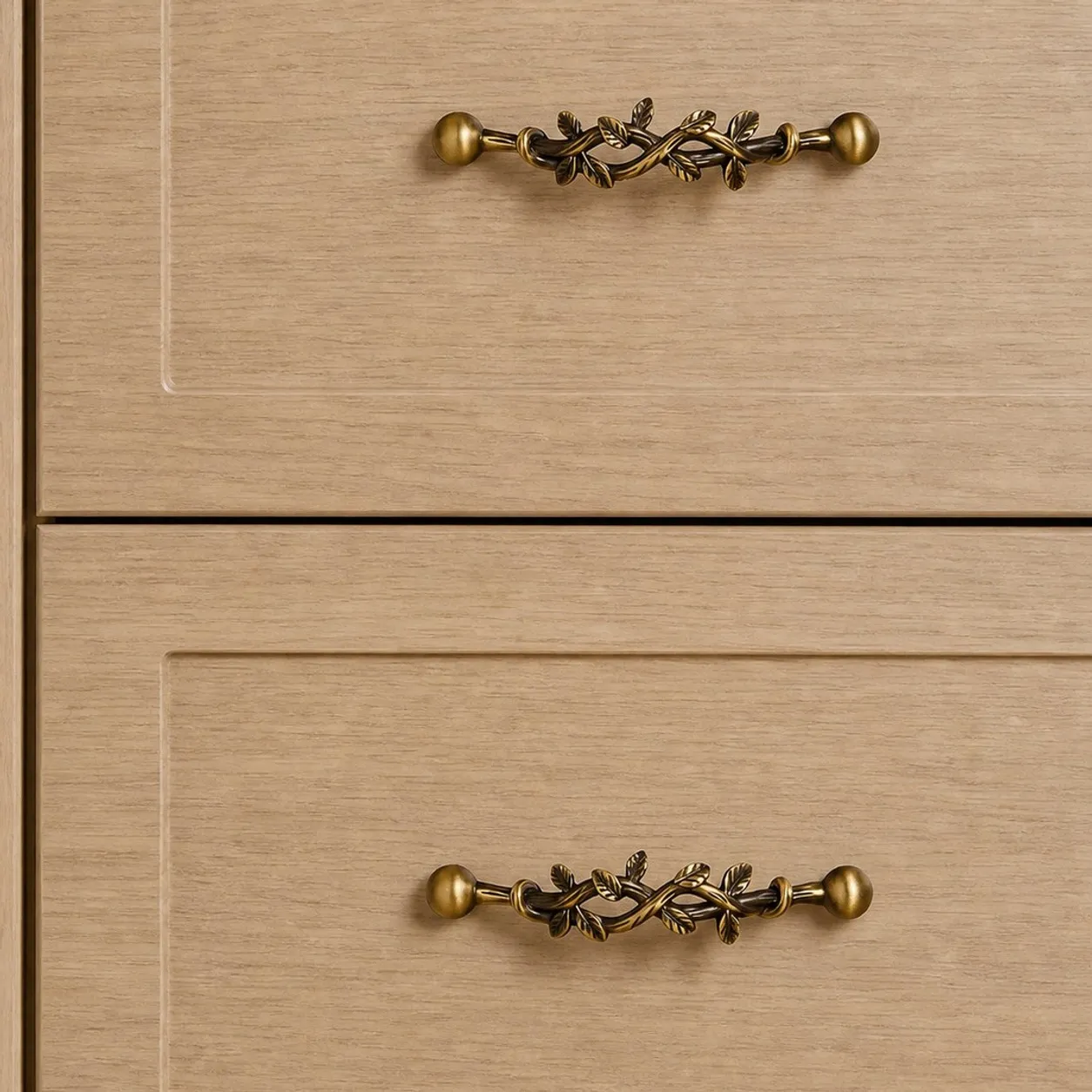 Leaf-shaped solid brass cabinet pulls installed on cabinet drawers