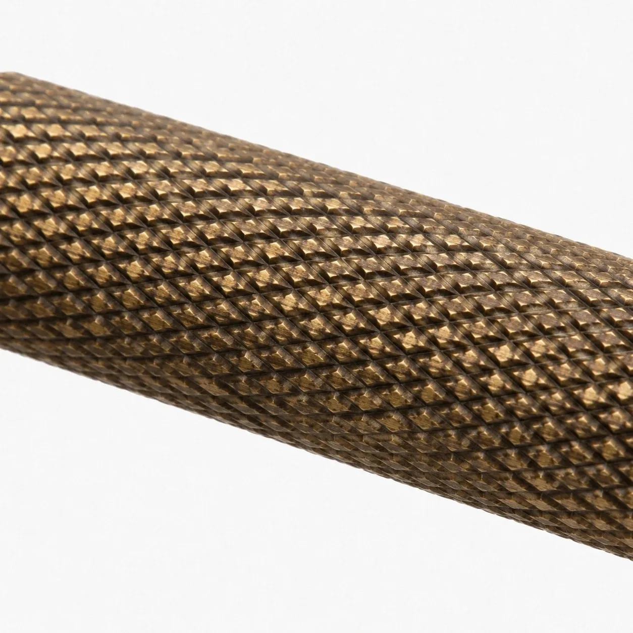 Close view of textured brass grip pattern