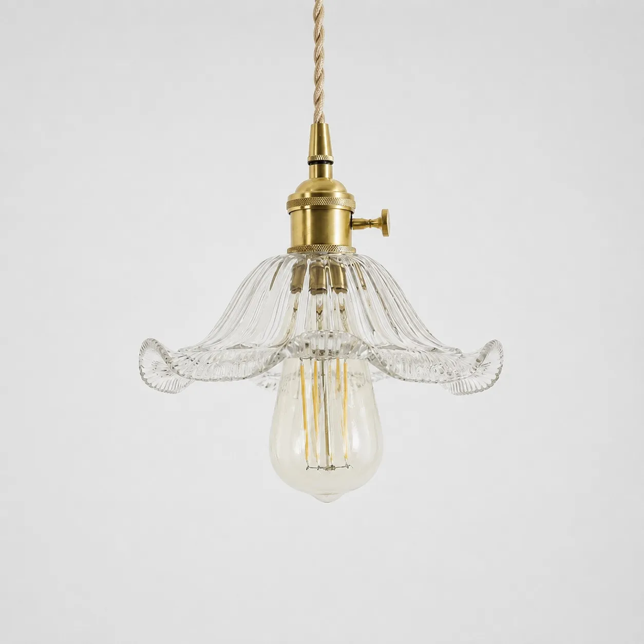 Style N textured glass shade with antique brass E27 socket, front view
