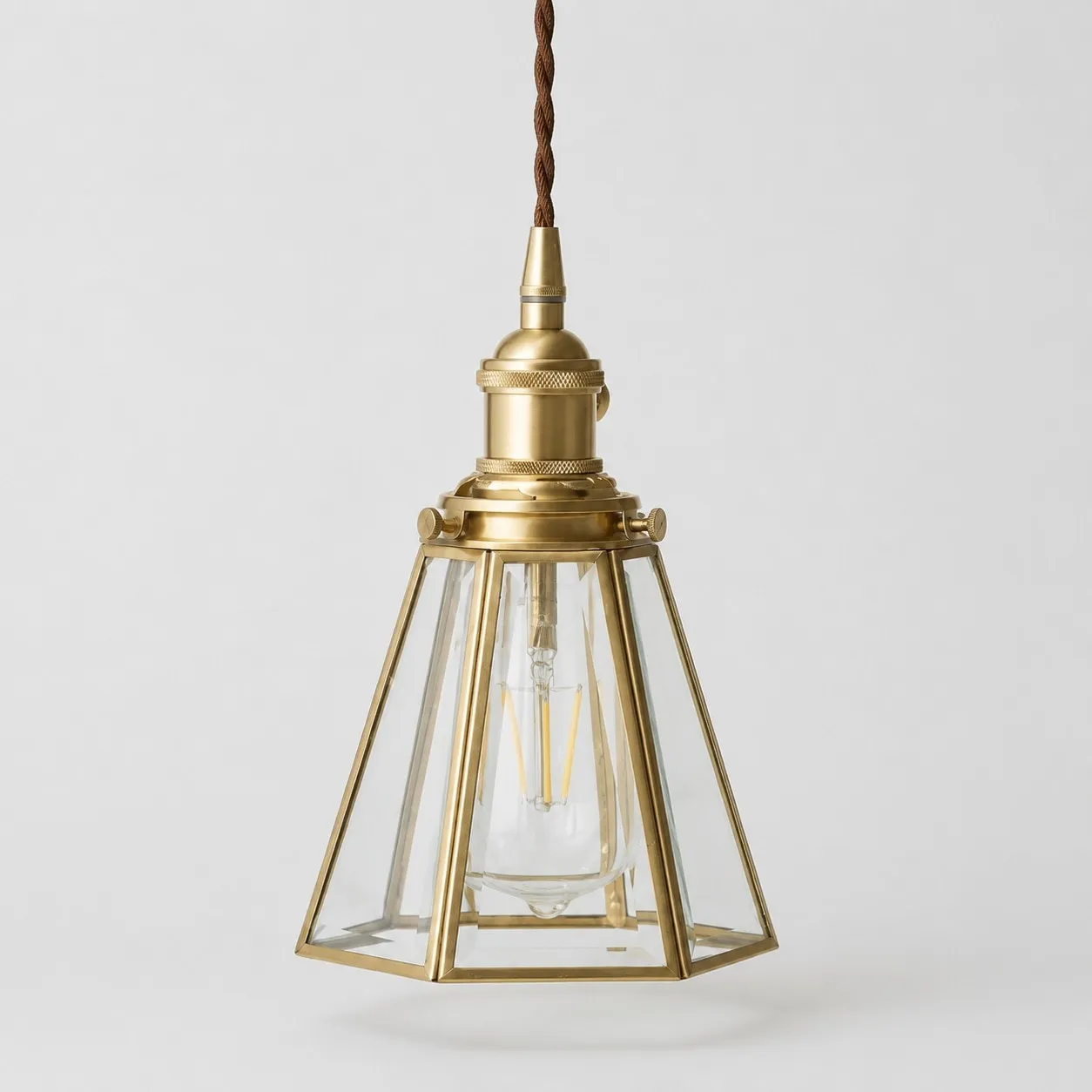 Clear glass pendant light with iron canopy