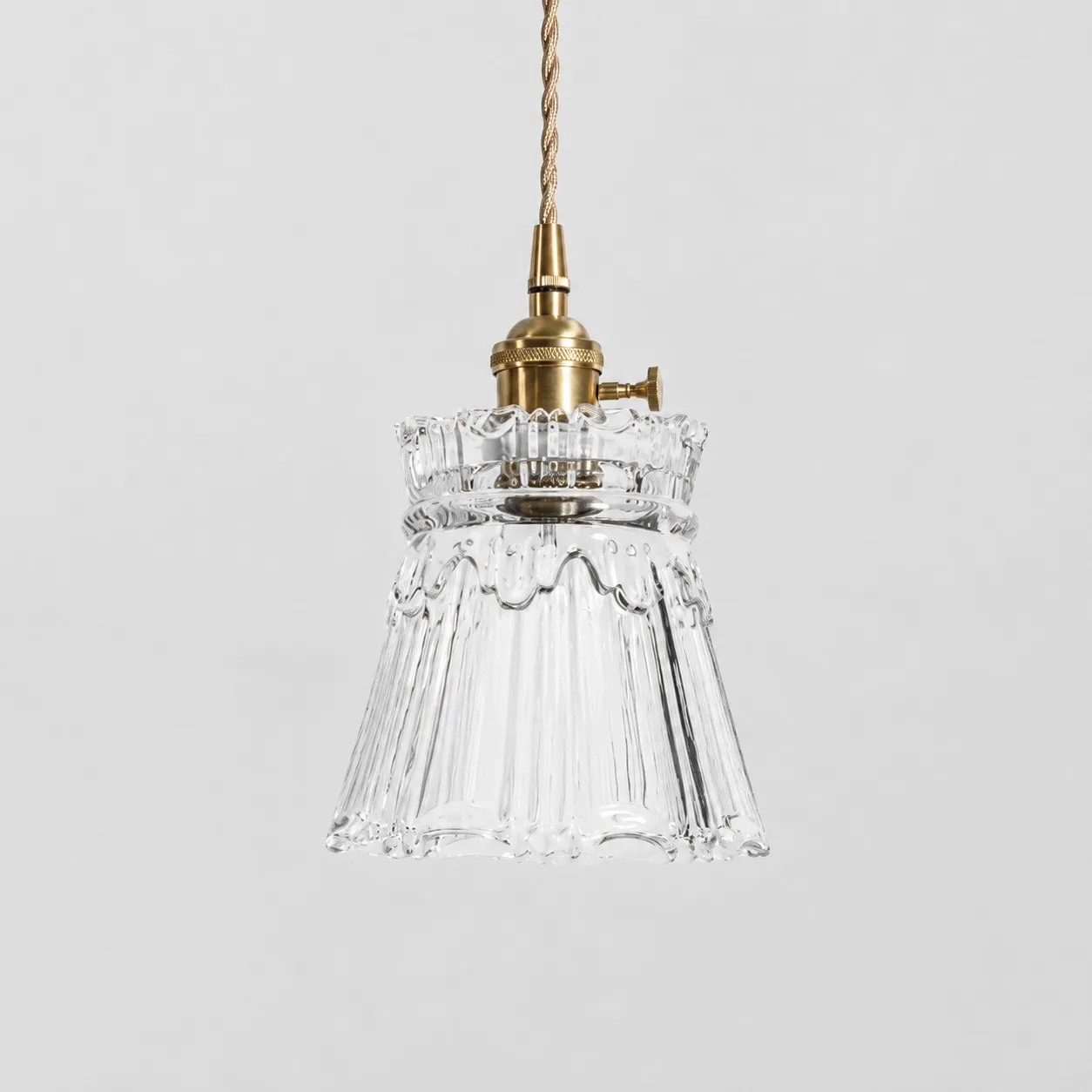 Style M - Clear textured glass shade with antique brass E27 socket, front view